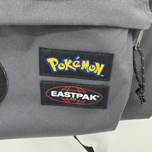 NWT Pokemon x Eastpak Day Pak'r Patches Grey 24L Backpack